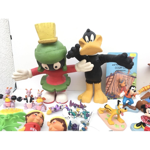 385 - A large collection of toy figures featuring Disney..Looney Tunes and others NO RESERVE