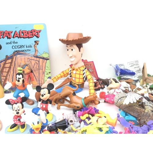 385 - A large collection of toy figures featuring Disney..Looney Tunes and others NO RESERVE