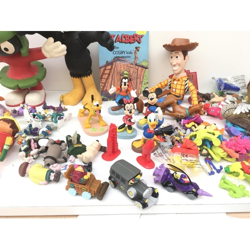 385 - A large collection of toy figures featuring Disney..Looney Tunes and others NO RESERVE