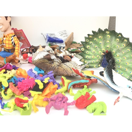 385 - A large collection of toy figures featuring Disney..Looney Tunes and others NO RESERVE
