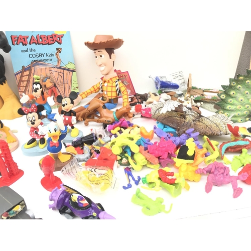 385 - A large collection of toy figures featuring Disney..Looney Tunes and others NO RESERVE