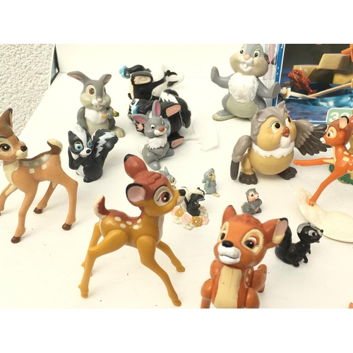 389 - A collection of mainly Disney figures including Bambi..Mulan ..Anastasia. Also includes Playmobil 38... 