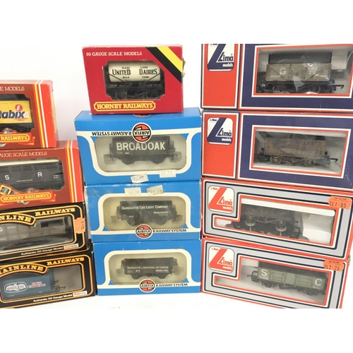 393 - A Collection of Boxed 00 Gauge Wagons. Including Hornby. Llima. Mainline.