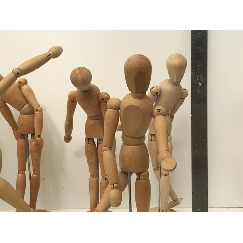 395 - A collection of of 9 articulated human wooden mannequins approximately 12 inches. All have good move... 
