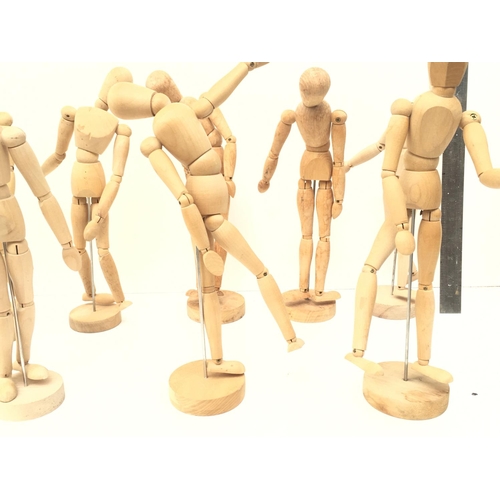 395 - A collection of of 9 articulated human wooden mannequins approximately 12 inches. All have good move... 
