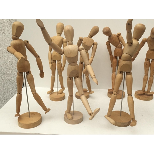 395 - A collection of of 9 articulated human wooden mannequins approximately 12 inches. All have good move... 