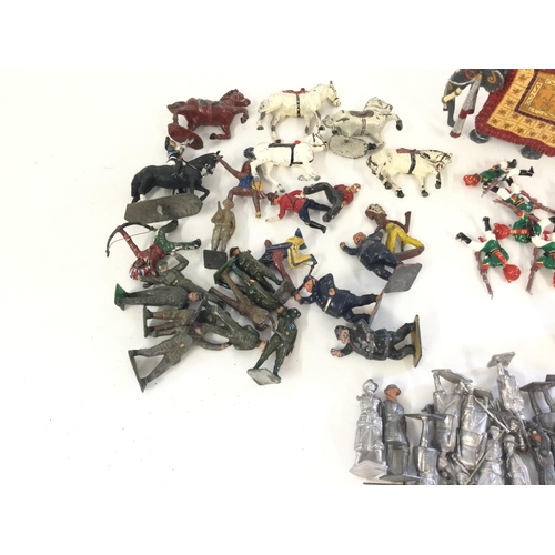 422 - A box containing a quantity of mixed Britains. Crescent lead figures to include circus. Cowboys. Sta... 