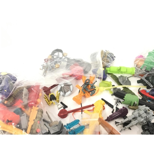 56 - A collection of 1980s and 1990s assorted accessories from numerous toy lines