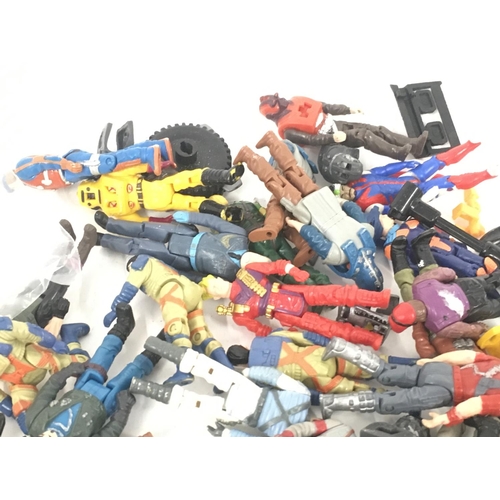 58 - A collection of MASH figures and helmets.