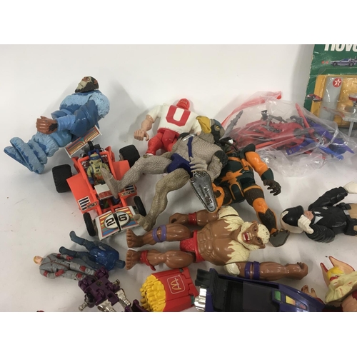 59 - A mixed collection of 80s figures..toys and accessories including Mash..Ghostbusters..etc