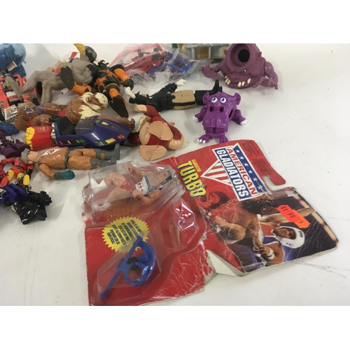 59 - A mixed collection of 80s figures..toys and accessories including Mash..Ghostbusters..etc