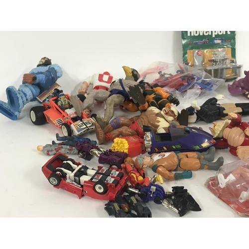 59 - A mixed collection of 80s figures..toys and accessories including Mash..Ghostbusters..etc