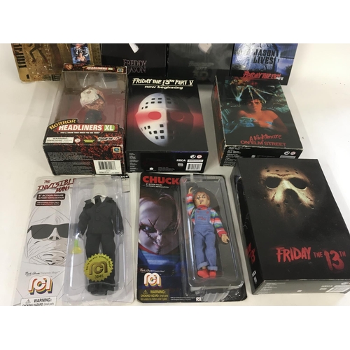 62 - A collection of 10 boxed Horror related action figures.