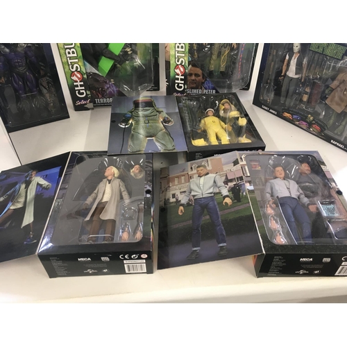 66 - A collection of 7 boxed action figures from the 1980s including Back to the Future ..Ghostbusters an... 