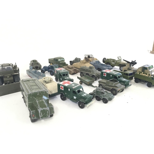 92 - A collection in excess of 20 Playworn diecast model military vehicles by various manufacturers.