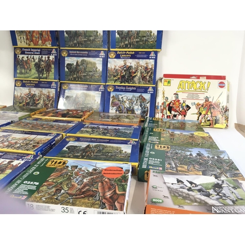 93 - A collection in of 29 boxed model military soldiers and accessories through the ages. Manufacturers ... 