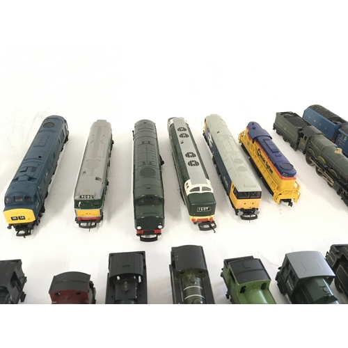 97 - A collection of model railway engines..carriages ..wagons and track. All 00 gauge. Makers include Ho... 