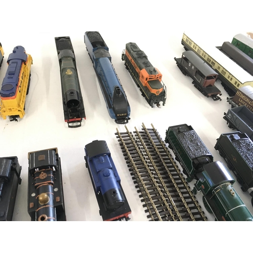 97 - A collection of model railway engines..carriages ..wagons and track. All 00 gauge. Makers include Ho... 