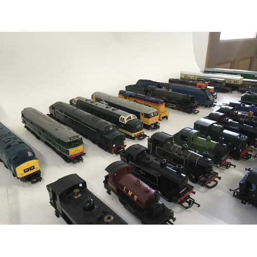 97 - A collection of model railway engines..carriages ..wagons and track. All 00 gauge. Makers include Ho... 