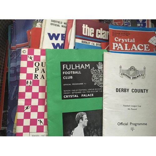 165 - Crystal Palace Football Programmes: Small suitcase of programmes with just over 50 being the small h... 