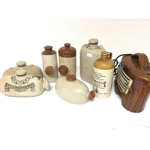 1021 - A Collection of stoneware bottles including a Usquaebach Scottish whisky bottle, Doulton Improved fo... 