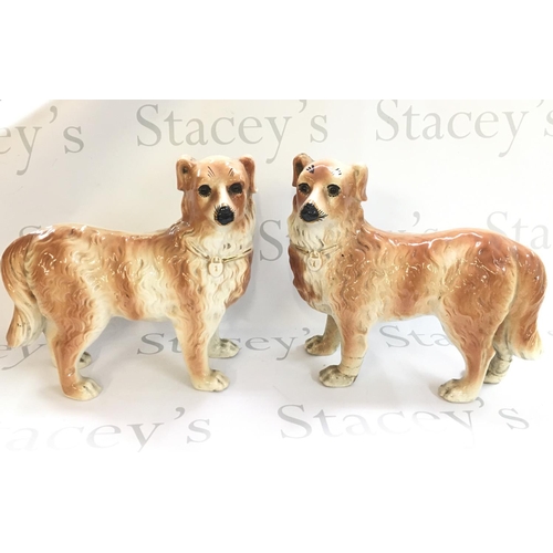 1032 - A pair of ceramic Staffordshire dog figures with glass eyes. 28.5cm tall. Some damage This lot canno... 