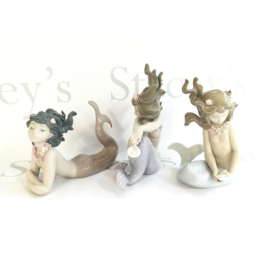 1034 - Three Lladro mermaid porcelain figures. 11 to 17cm tall. No obvious large damage or restoration