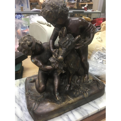 1048 - A bronze classical figure group depicting cherubs and goat .