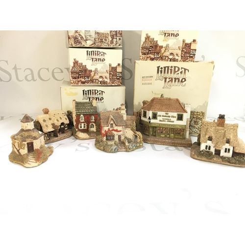 1051 - A Collection of boxed Lilliput lane resin cottage models. This lot cannot be posted