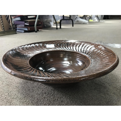 1075 - A David Leach stoneware brown glazed bowl with incised decoration. 36cm