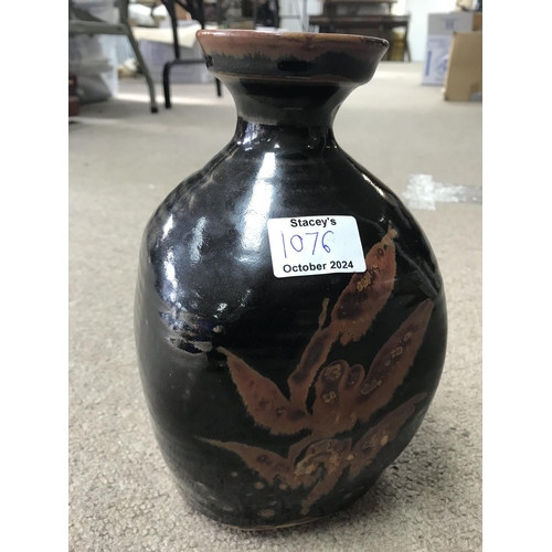 1076 - A David Leach stoneware brown glazed bottle vase. 25cm