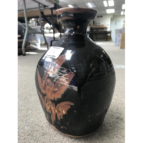 1076 - A David Leach stoneware brown glazed bottle vase. 25cm