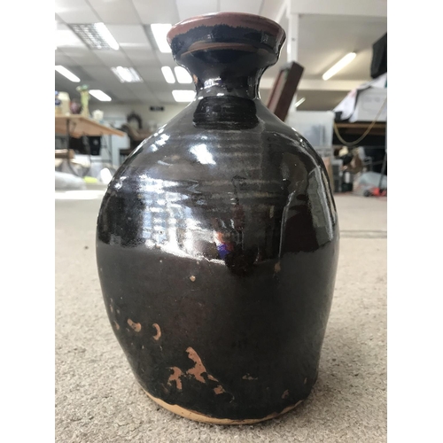 1076 - A David Leach stoneware brown glazed bottle vase. 25cm