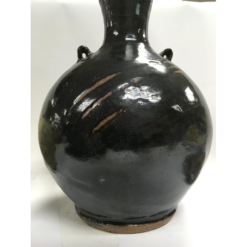 1083 - A collection of stone ware art pottery comprising twin handle blue and black glazz vase 30 cm Two st... 