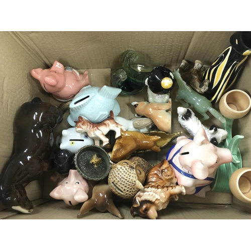 1091 - A box of assorted ceramic and glass items including money boxes and a beswick horse. Postage D