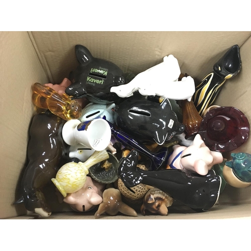 1091 - A box of assorted ceramic and glass items including money boxes and a beswick horse. Postage D