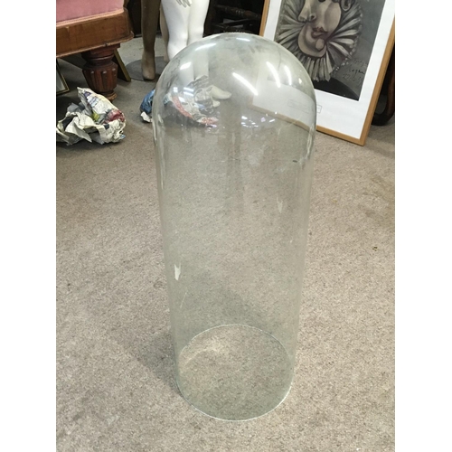 1125 - A tall glass dome 58cm tall approximately