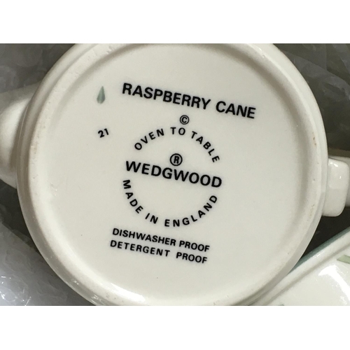 1133 - A Wedgwood Raspberry cane set including bowls, cups, dishes etc. This lot cannot be posted