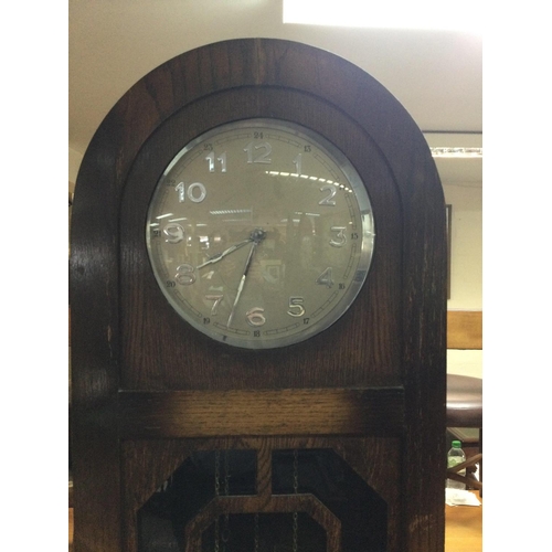 1221 - A oak three train longcase clock the circular dial with Arabic numerals. NO RESERVE