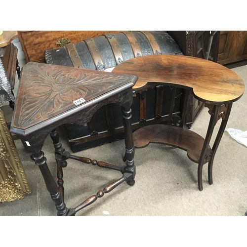 1227 - An Edwardian rosewood occasional table with a shaped top on splayed legs United by an under-tier and... 