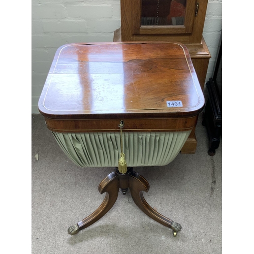 1251 - A 19th Century Regency Brass Inlaid Rosewood Lift Top Work Table with three down swept brass inlaid ... 