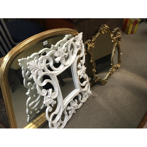 1255 - A set of four gilt framed and white painted wood mirror with shaped frames including an overmantel m... 