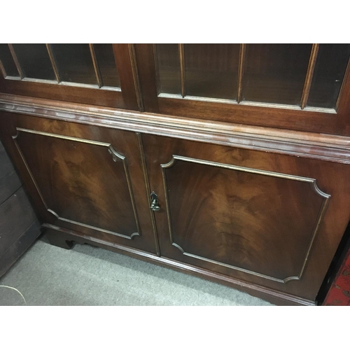 1269 - A mahogany bookcase with glazed doors above cupboards, dimensions 185x90x34cm