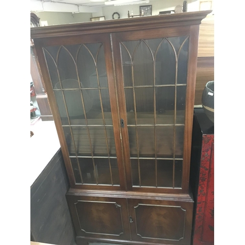 1269 - A mahogany bookcase with glazed doors above cupboards, dimensions 185x90x34cm