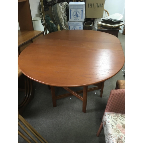 1271 - A drop leaf teak table, 74cm tall, 154cm wide. NO RESERVE