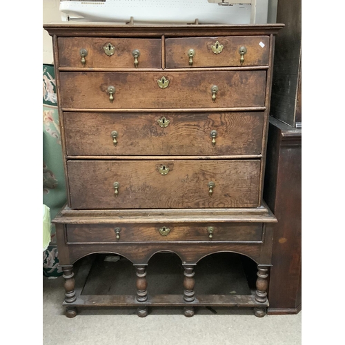 1273 - An early 18th century oak chest on later stand from the Queen Anne period. 103cm x 137.5cm x 62cm