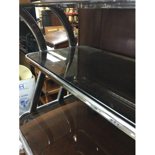 1276 - A three tier chrome trolley inset with glass tops on casters . 83cm x 44 cm . NO RESERVE