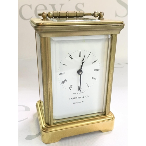 1295 - A brass Garrard & Co carriage clock, dimensions 6x8x12cm approximately. With key , seen working. thi... 