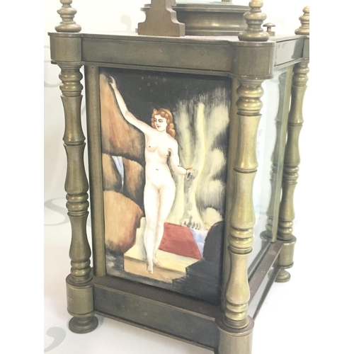 1299 - A mid 20th century carriage clock with porcelain panels decorated with nude women. This lot cannot b... 