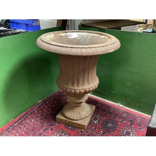 2056 - A small cast iron garden urn. 36cm